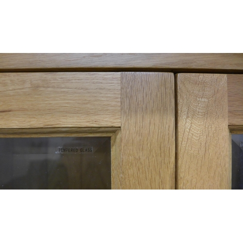 1369 - A Manor oak and glass display unit, missing one glass shelf