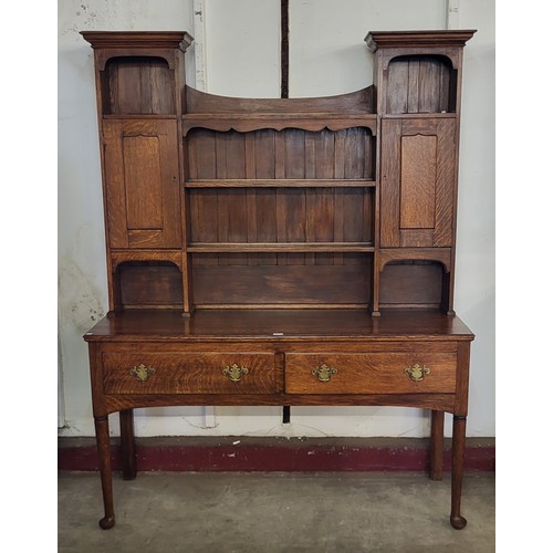 83 - A George III style oak dresser