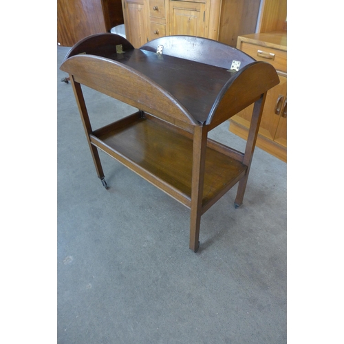 100 - A Victorian style mahogany butlers tray on a stand