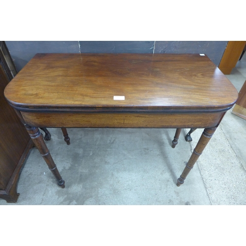 113 - A George IV mahogany D-shaped fold over games table