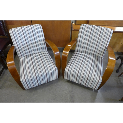 116 - A pair of Art Deco style beech and fabric upholstered fireside armchairs