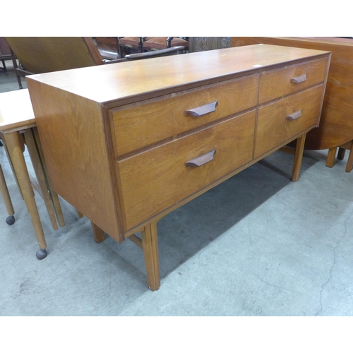 12 - A teak four drawer sideboard