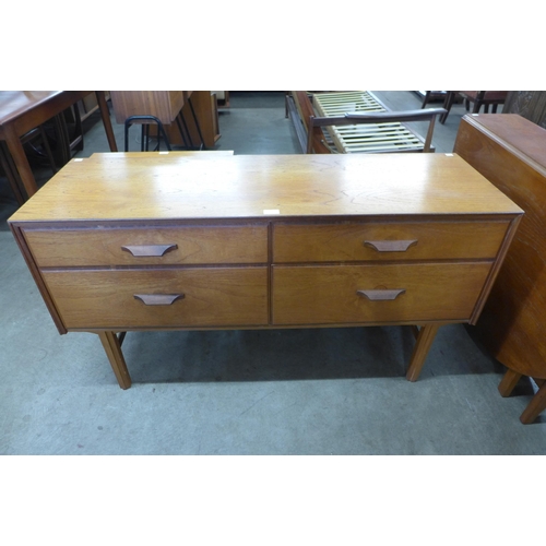 12 - A teak four drawer sideboard