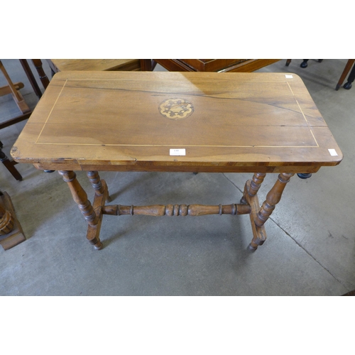 130 - A Victorian walnut stretcher table