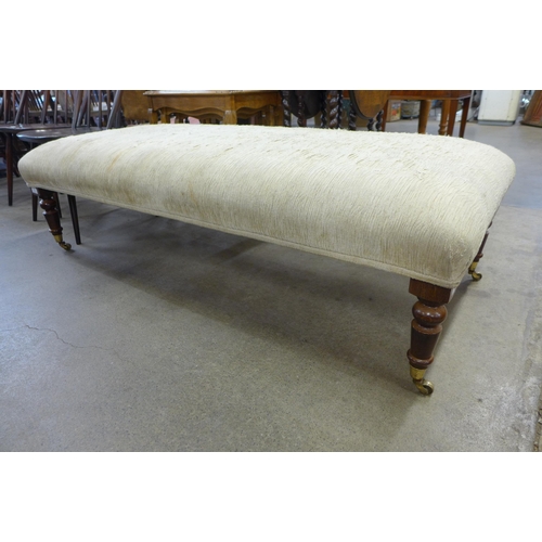 136 - A Victorian style beech and fabric upholstered footstool