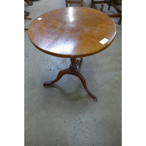 138 - A Victorian mahogany circular tripod wine table