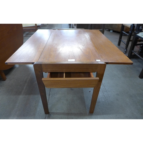 14 - A teak rectangular drop leaf coffee table