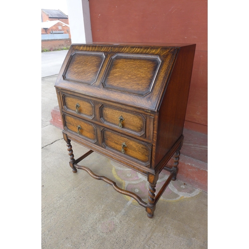 145B - An early 20th Century oak barleytwist bureau