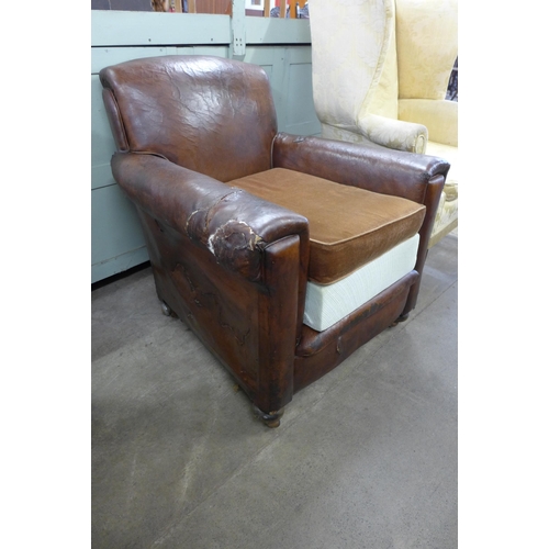 151 - A pair of Art Deco brown leather armchairs