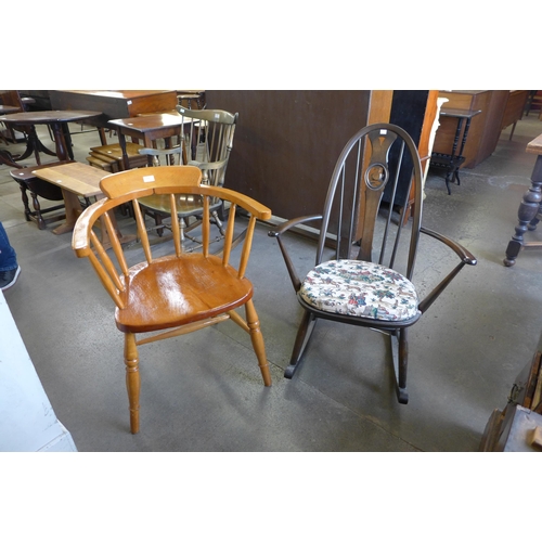 164 - An Ercol elm and beech rocking chair and a beech smoker's bow