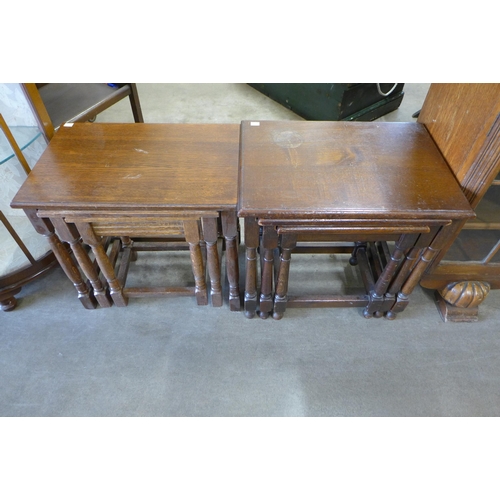 168 - An oak bow front display cabinet and two oak nests of tables