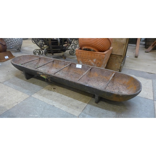 203 - A cast iron feeding trough