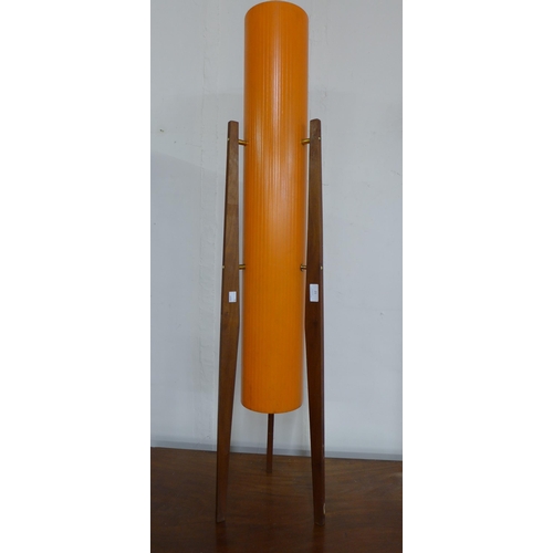 21 - A teak floor standing rocket lamp