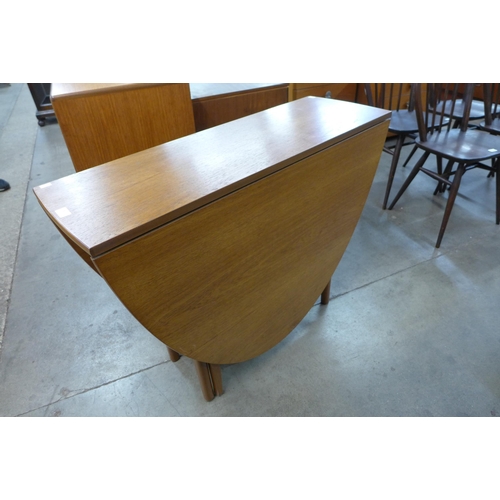 25 - A teak drop-leaf table