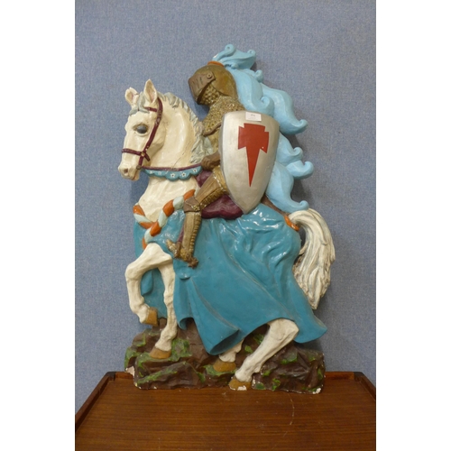 251 - A painted plaster armorial plaque, designed by Beryl Furber, Dec. 1963