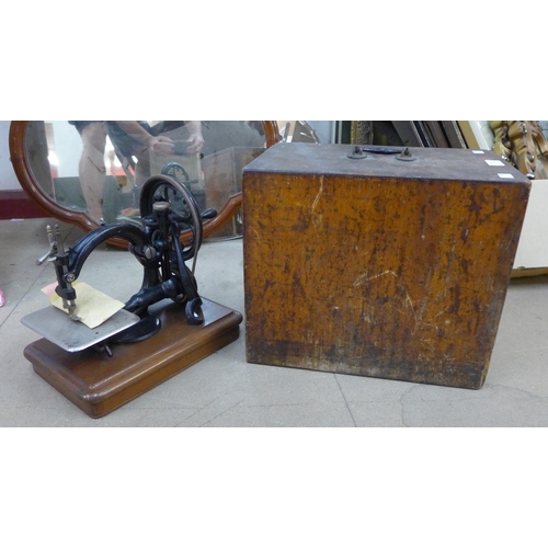 253 - An early 20th Century cased Wilcox & Gibbs sewing machine