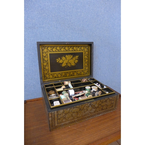 257 - A Victorian ebonised and parcel gilt floral decorated lady's sewing box