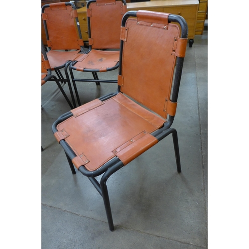 32 - A set of Les Arc style black tubular steel and leather chairs