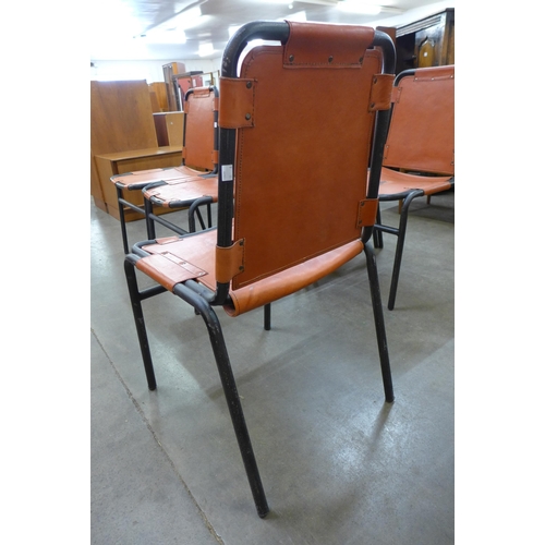 32 - A set of Les Arc style black tubular steel and leather chairs