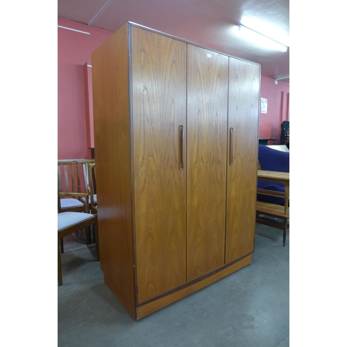 32A - A G-Plan Fresco teak three door wardrobe