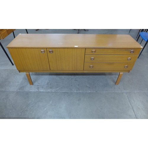 34 - A teak sideboard