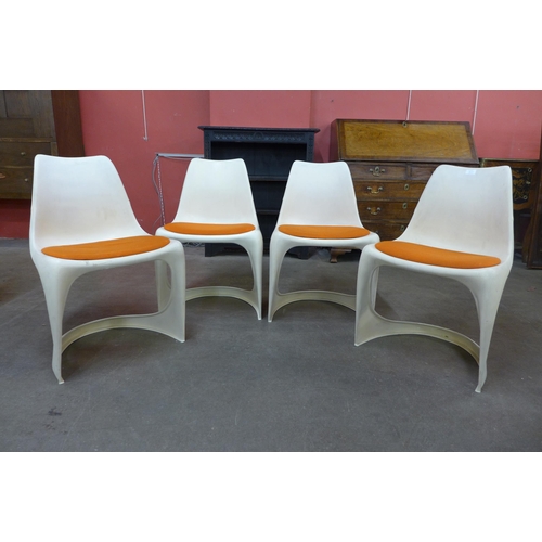 34A - A set of four Danish Cado white perspex chairs, designed by Steen Ostergaard