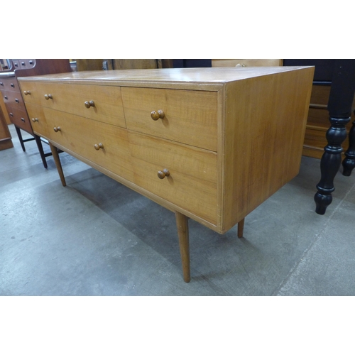 35 - A teak six drawer sideboard