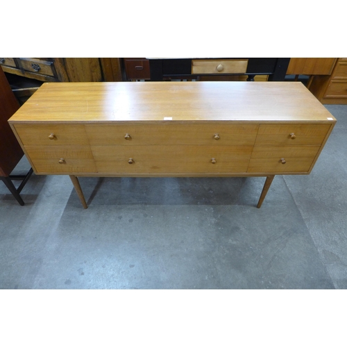 35 - A teak six drawer sideboard