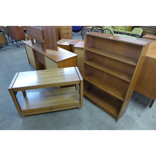 37 - A teak open bookcase and a simulated rosewood metamorphic trolley