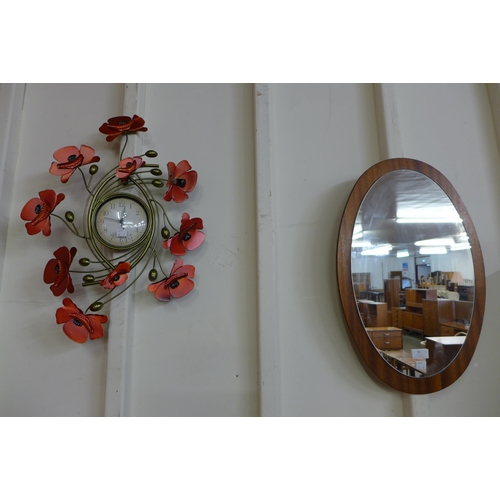 55 - A teak framed mirror and a contemporary wall clock