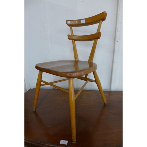 57 - An Ercol Blonde elm and beech child's red dot chair