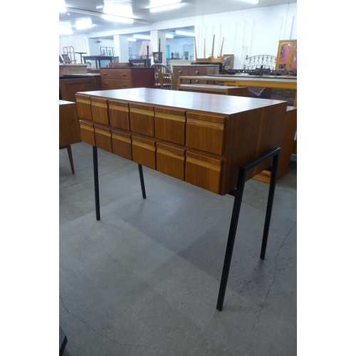 59B - A teak index drawer cabinet on black tubular metal legs