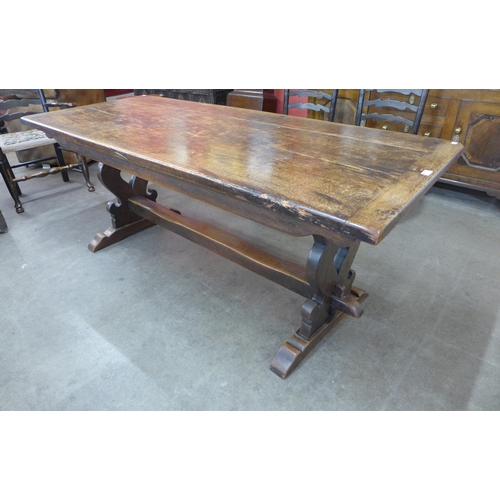 62 - An 18th Century style oak refectory table, 74cms h, 183cms l, 76cms w