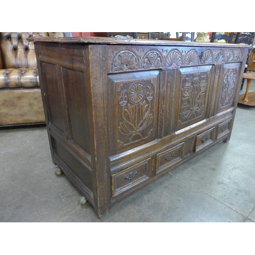 65 - A Charles II carved oak mule chest