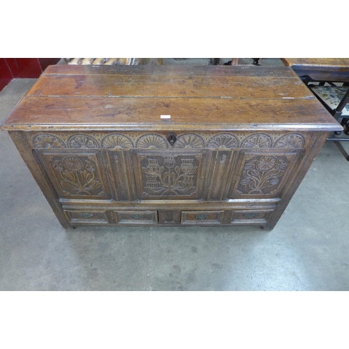 65 - A Charles II carved oak mule chest