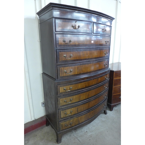 69 - A George III style mahogany bow front chest on chest