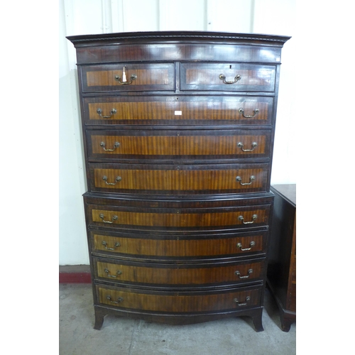 69 - A George III style mahogany bow front chest on chest