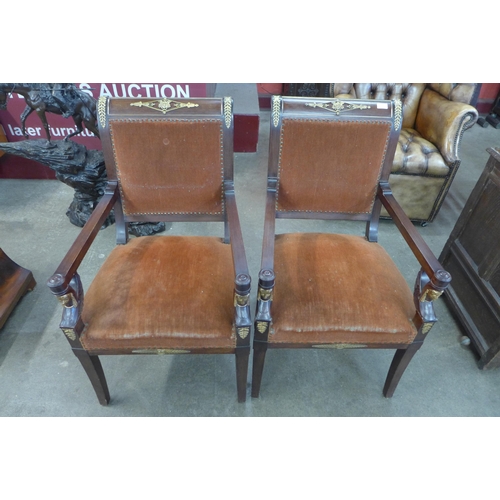 72 - A pair of 19th Century style French Egyptian Revival mahogany and gilt metal mounted fauteuil chairs