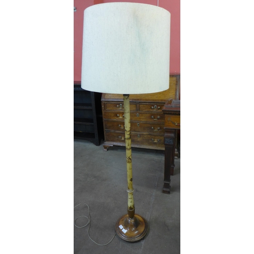 76 - A cream Japanned standard lamp