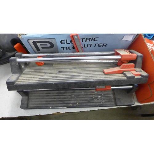 2072 - 2 Electric Plasplugs tile cutters and 2 manual Plasplugs tile cutters