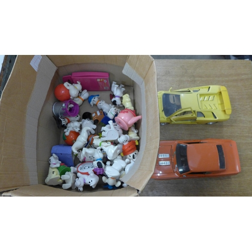 2093 - Two 1/18 scale die-cast cars and a box of toy dogs