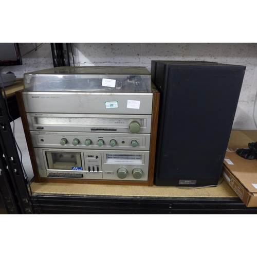 2164 - A Sharp stereo music centre; a SG1 turntable, a stereo tuner, a stereo amplifier, cassette deck with... 