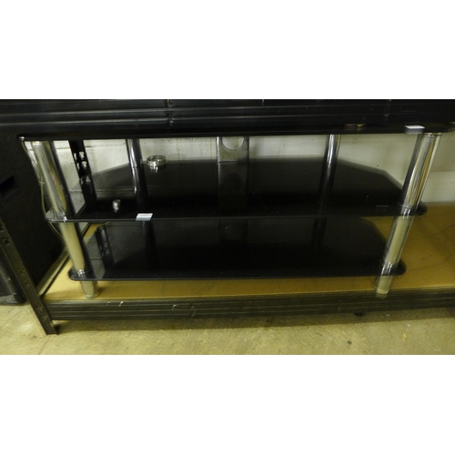 2177 - A black glass and chrome TV stand