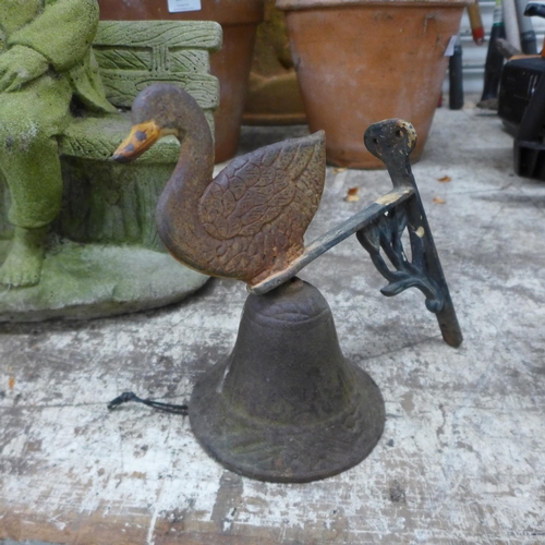 2213 - Garden ornaments: a man sat on a bench, bird and a duck bell