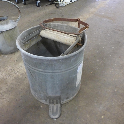 2231 - A galvanised watering can, mop bucket and water urn