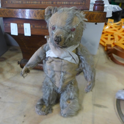 2248 - An inlaid wooden cased wall clock and a jointed Teddy bear