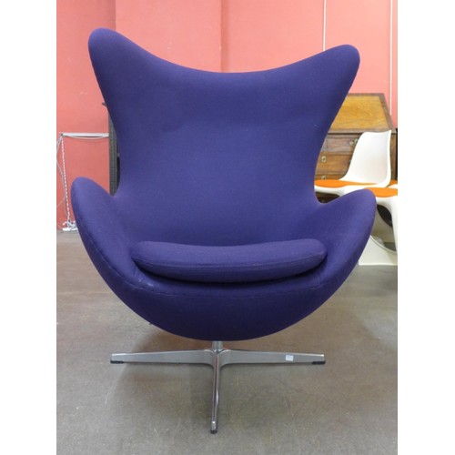 34C - An Arne Jacobsen style chrome and purple fabric revolving lounge chair