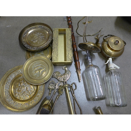 1106 - A collection of metalwares including chargers, a bed warming pan, cruet set, etc. **PLEASE NOTE THIS... 