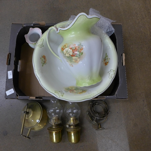 1150 - A pair of paraffin lamps with wall brackets and a wash jug and bowl **PLEASE NOTE THIS LOT IS NOT EL... 