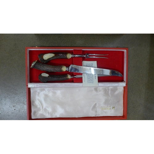 1153 - A three piece antler handled carving set, a part set of fish knives and forks, a plated water pot, o... 